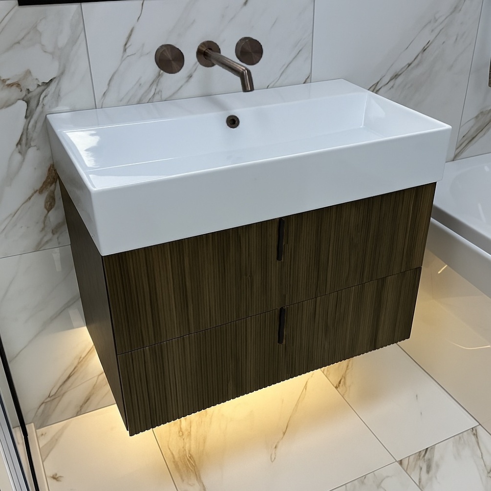 marlow wall hung vanity unit bourbon oak with vertical handles in marble bathroom - lifestyle shot